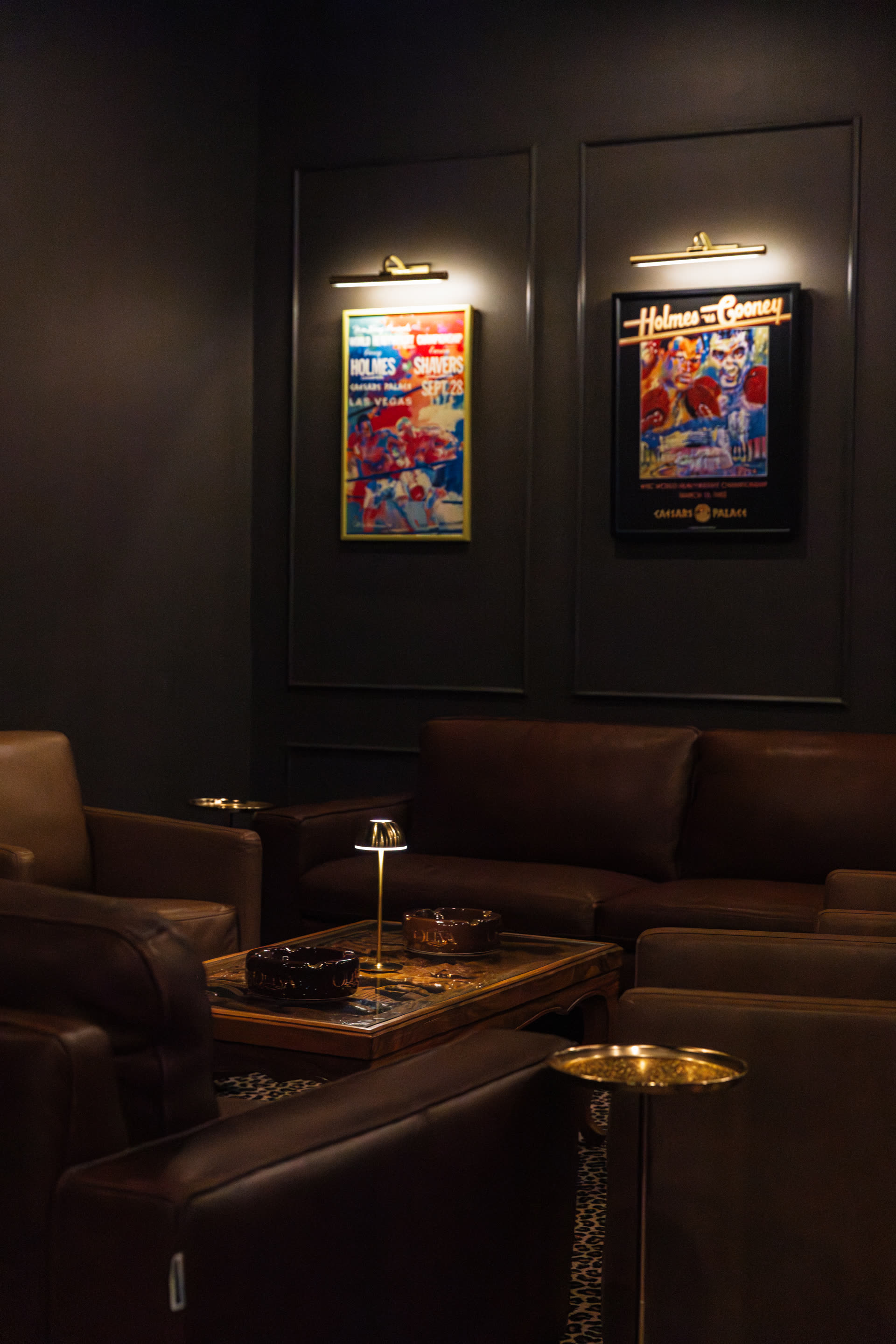 Framed photographs and posters in the lounge at Legends